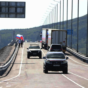 In this photo released by the Government of Primorsky Krai Region on Monday, Sept. 7, 2026, vehicles drive across the new bridge between Russia and North Korea named after the Soviet officer Yakov Novichenko, who is credited with saving North Korea's founding leader, Kim Il-sung, over the Tumannaya River in Primorsky Krai Region of Russia.