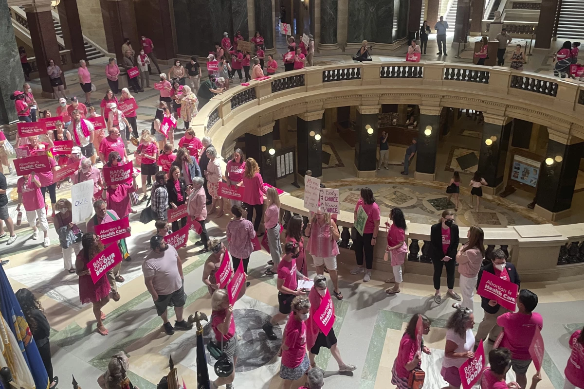 Abortion rights supporters are seen gathering for a 'pink out' protest organized by Planned Parenthood in the rotunda of the Wisconsin Capitol, June 22, 2022, in Madison, Wis.