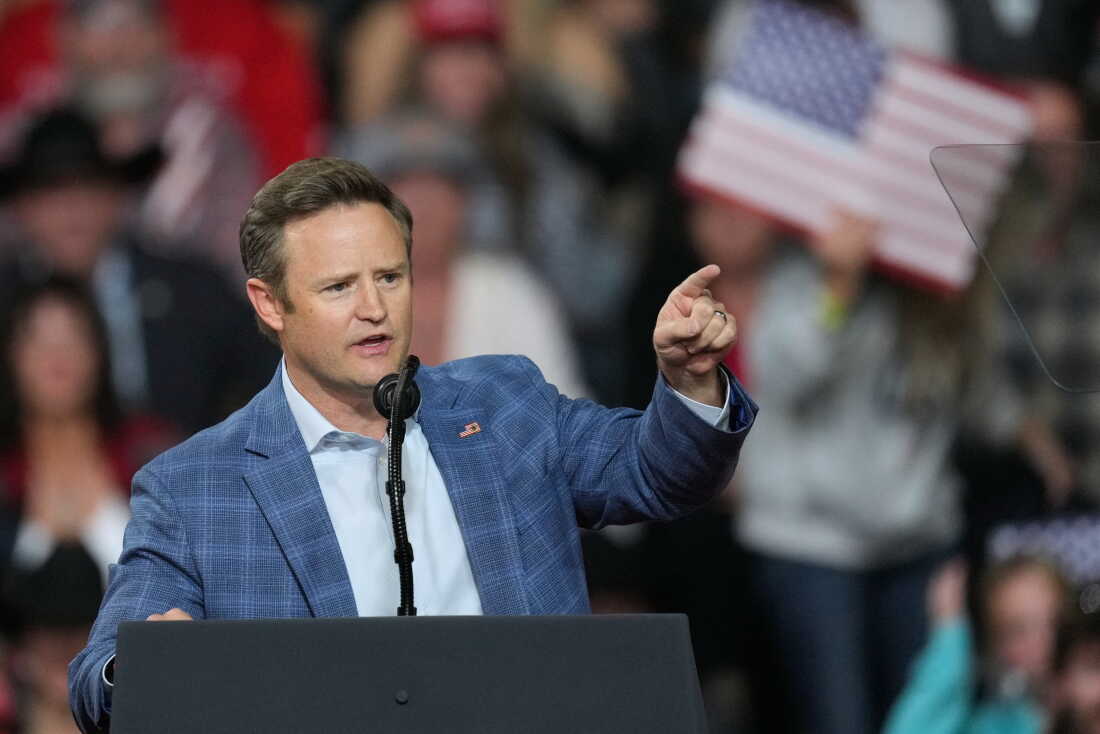 Aaron Flint, the GOP candidate for the House in Montana's 1st District, speaks ahead of an address by President Trump in Kalispell, Mont. on Oct. 14.