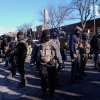 Federal agents stand near the site of a shooting Saturday, Jan. 24, 2026, in Minneapolis.