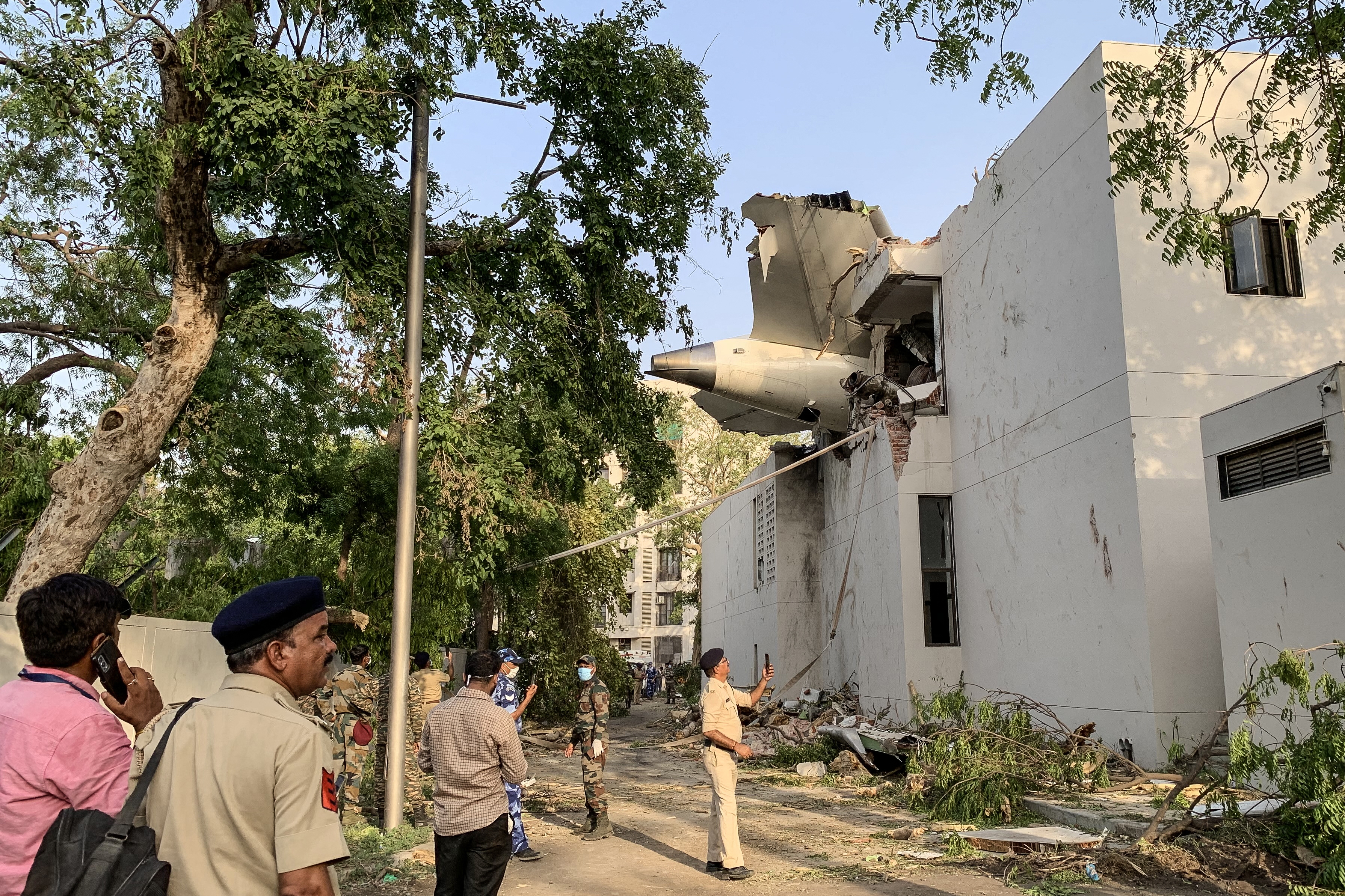 The back of Air India Flight 171 juts out of a building after the Boeing 787-8 Dreamliner crashed in a residential area near the airport in Ahmedabad on Thursday.