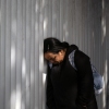 An asylum seeker reacts while waiting for news on her appointment with U.S. authorities before crossing through El Chaparral port in Tijuana, Baja California state, Mexico, on Jan. 20, 2025.