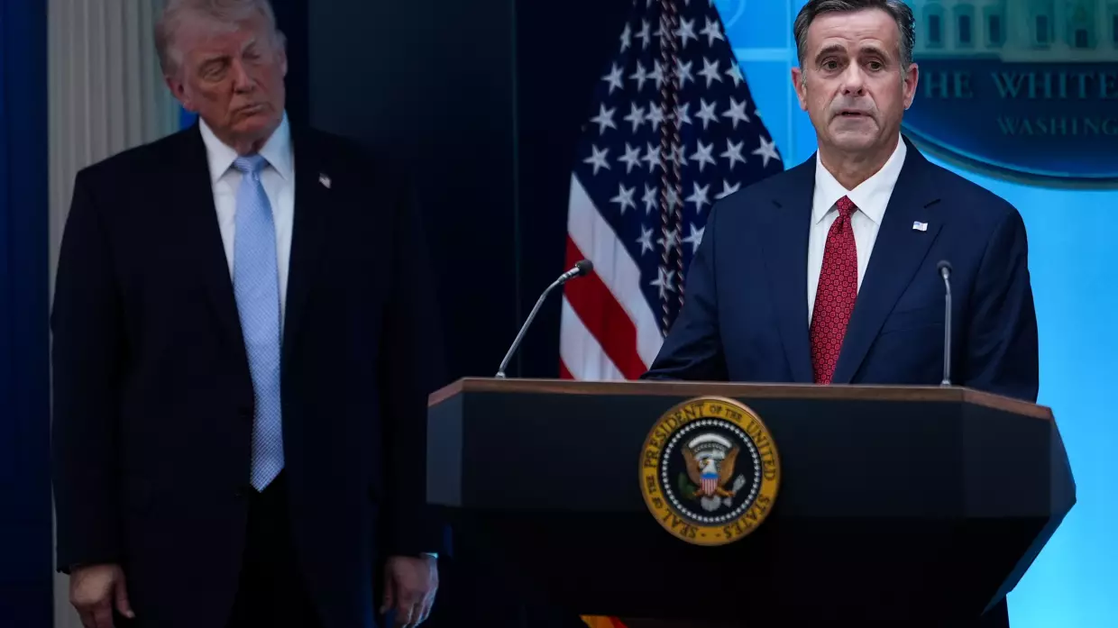 FILE - CIA Director John Ratcliffe, accompanied by President Donald Trump, speaks with reporters in the James Brady Press Briefing Room at the White House in Washington, April 6, 2026.