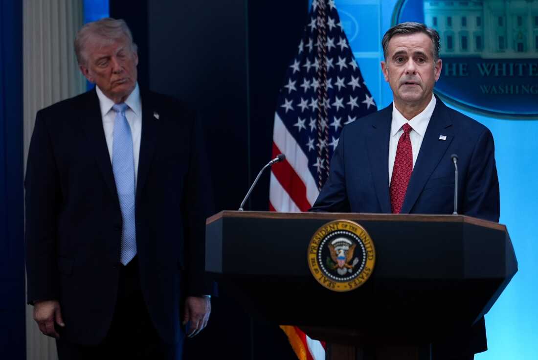 FILE - CIA Director John Ratcliffe, accompanied by President Donald Trump, speaks with reporters in the James Brady Press Briefing Room at the White House in Washington