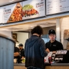A customer pays for their food at a Chipotle Mexican Grill restaurant in Austin, Texas. Chipotle says its portion sizes have not shrunk, despite complaints shared on social media.