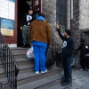 Larry Anderson (center), director of prevention services at Prevention Point, collects donations in the Kensington neighborhood of Philadelphia, Pennsylvania on February 28, 2025.