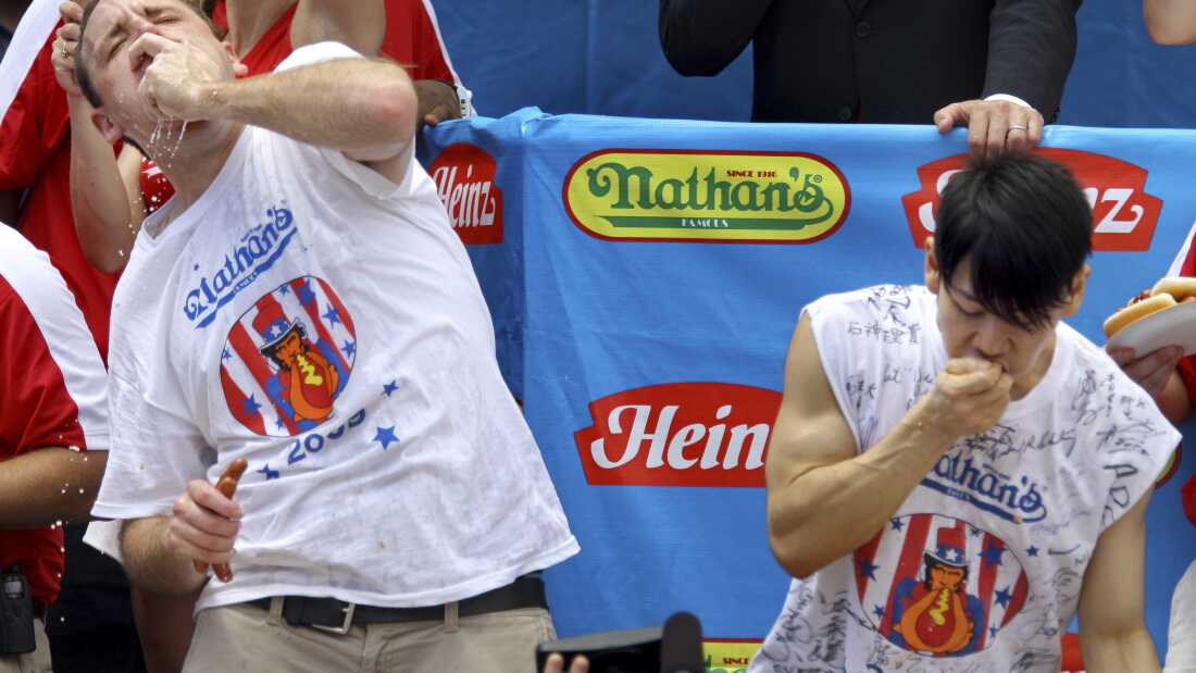 Joey Chestnut (L) and Takeru Kobayashi (R) compete in the Nathan's hot dog-eating contest on July 4, 2009.