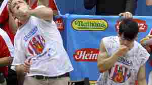 Joey Chestnut (L) and Takeru Kobayashi (R) compete in the Nathan's hot dog-eating contest on July 4, 2009.