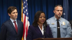 Assistant Attorney General Kristen Clarke of the Justice Department's Civil Rights Division, flanked by Minneapolis Mayor Jacob Frey, left, and Chief Brian O'Hara of the Minneapolis Police Department, speaks at a news conference at the U.S. Courthouse in Minneapolis, Monday, Jan. 6, 2025. (Jeff Wheeler/Star Tribune via AP)