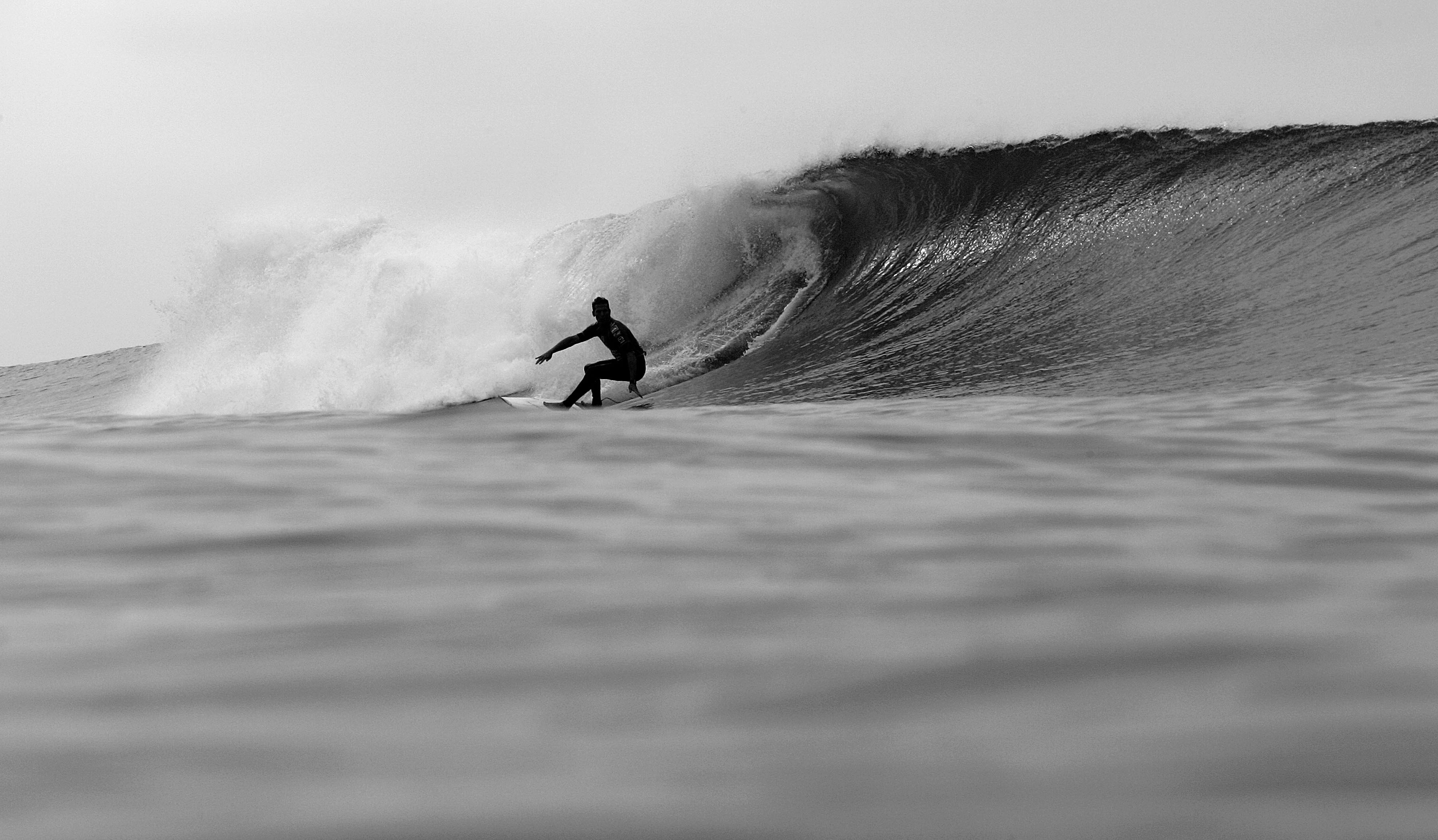 Andy Irons of Hawaii takes a bottom turn on a wave during the Boost Mobile Pro, Part of the Foster