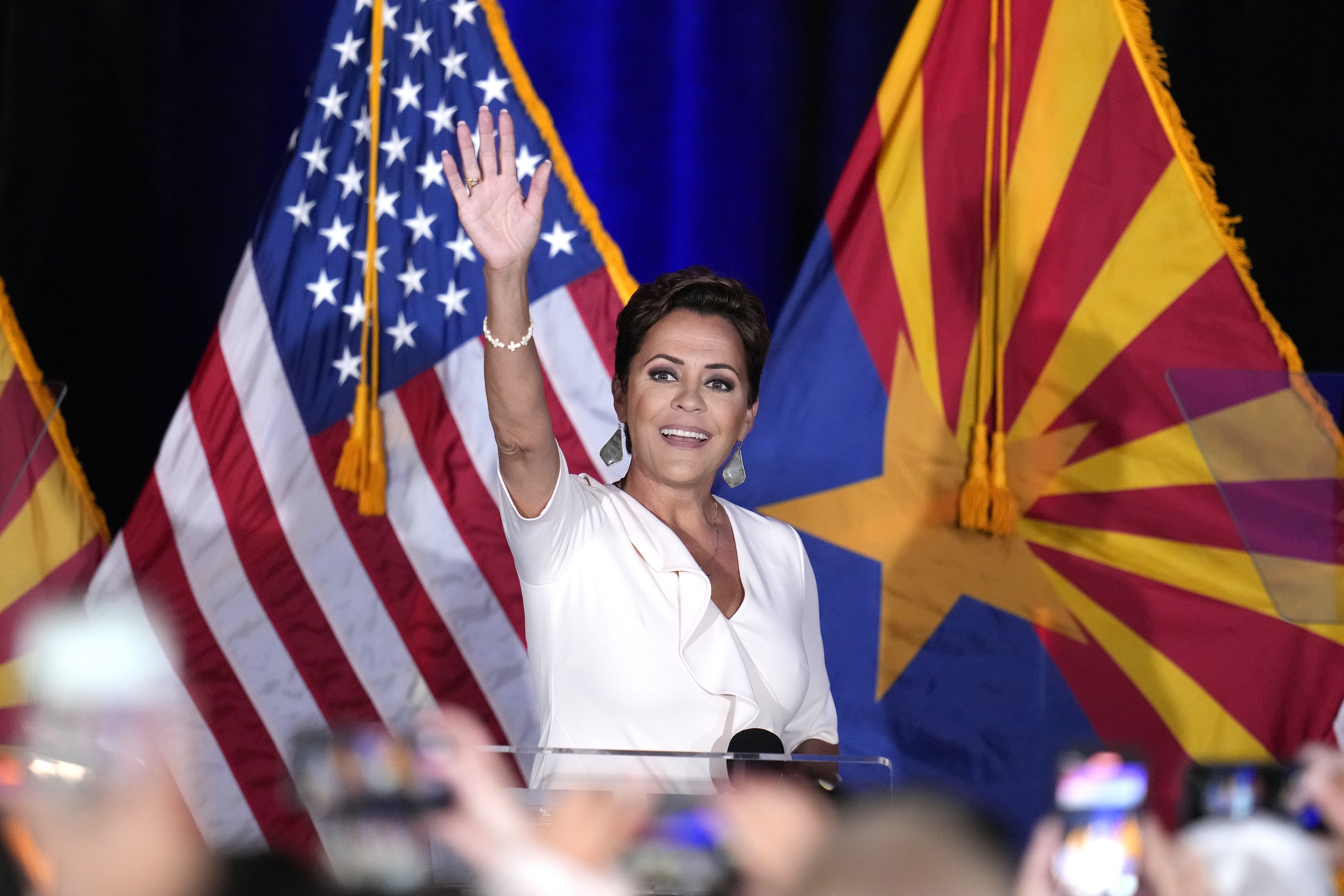 Republican Arizona Senate candidate Kari Lake waves to supporters as she arrives on stage after being declared her party's primary winner on Tuesday in Phoenix. (AP)