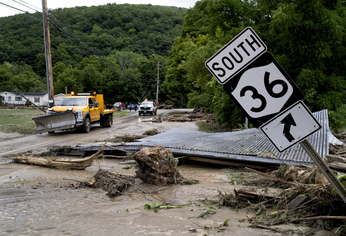 Debris from a building is seen along Route 36 in Canisteo, N.Y., on Friday after remnants of Tropical Storm Debby swept through the area.