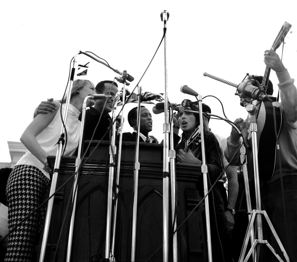 Musicians perform before 25,000 civil rights marchers in Montgomery, Ala. following a speech by Martin Luther King Jr. on March 25, 1965. Performers (from left to right) include Mary Travers, Harry Belafonte, Leon Bibb, Joan Baez and Oscar Brand.