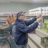 Paul B. Miller of Junction City, Ohio grocery shops at The Market in Logan, Ohio, on Dec. 9. Food aid was just one of many safety-net services offered here that faced disruption in 2025.