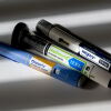 Three GLP-1 medications injection pens are shown displaying the brand names Ozempic, Zepbound and Wegovy.