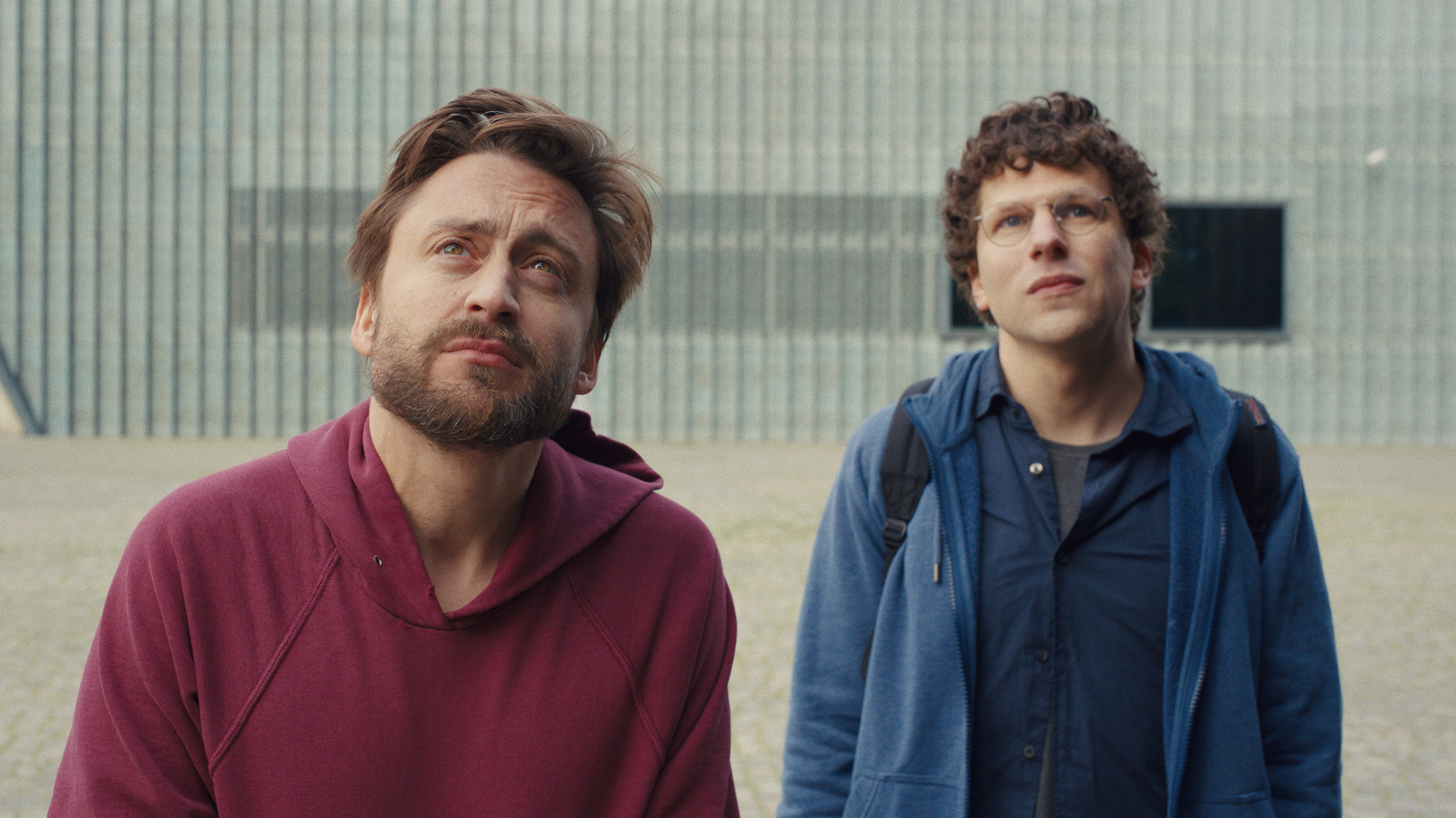 Cousins Benji (Kieran Culkin) and David (Jesse Eisenberg) tour through Poland to honor their beloved grandmother in <em>A Real Pain.</em> (Searchlight Pictures)