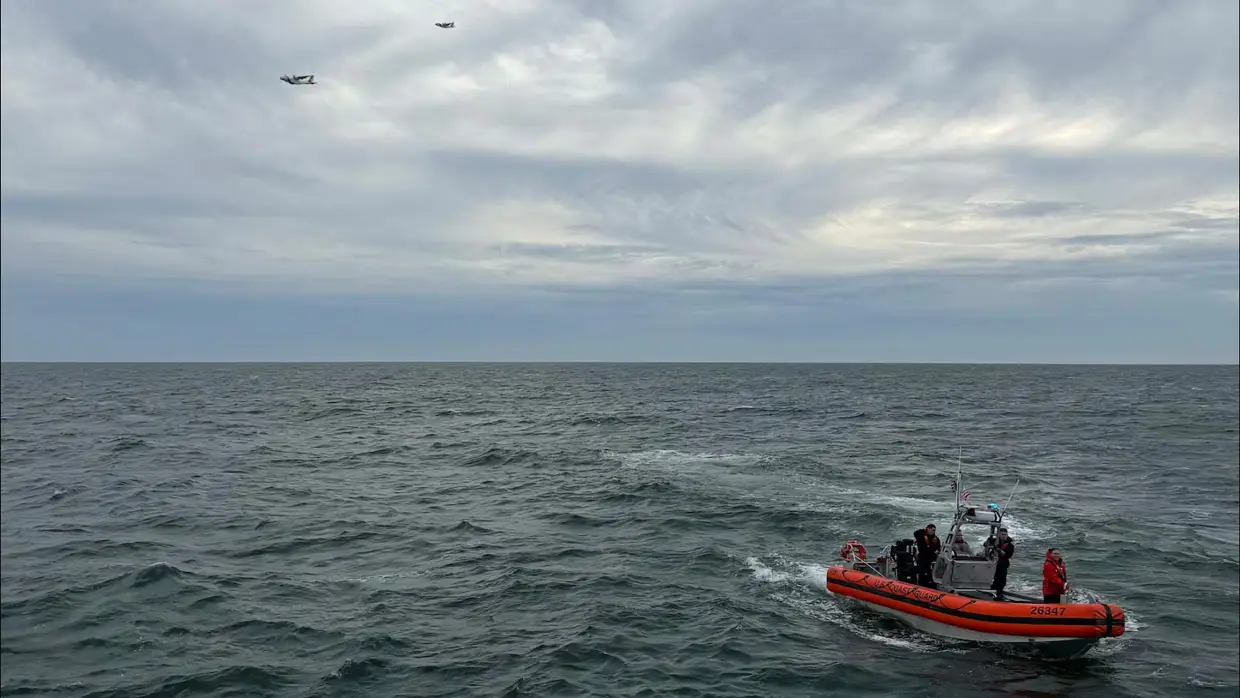In this photo released by U.S. Coast Guard, crew members search by air and on the water for a Boston-bound air ambulance that vanished off the coast of Nantucket, Massachusetts, on Saturday, Oct. 3, 2026.