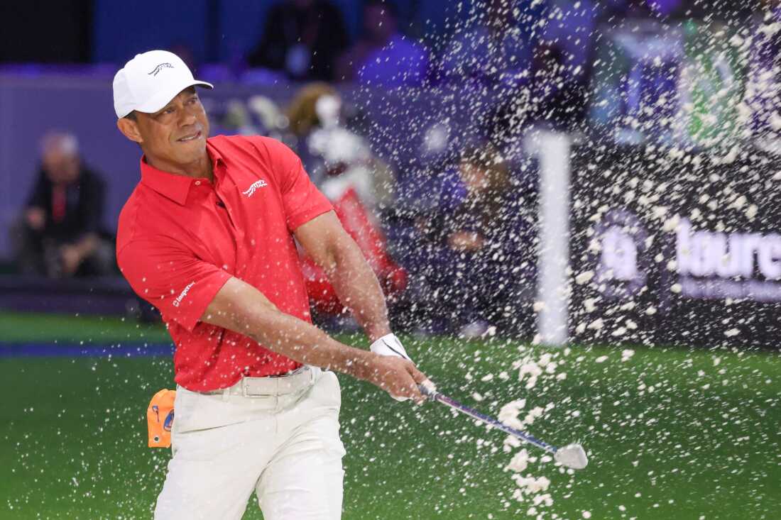 Tiger Woods of the Jupiter Links Golf Club plays a shot from a bunker on the eighth hole, during final day of TGL golf tournament, Tuesday, March 24, 2026, in Palm Beach Gardens Fla.
