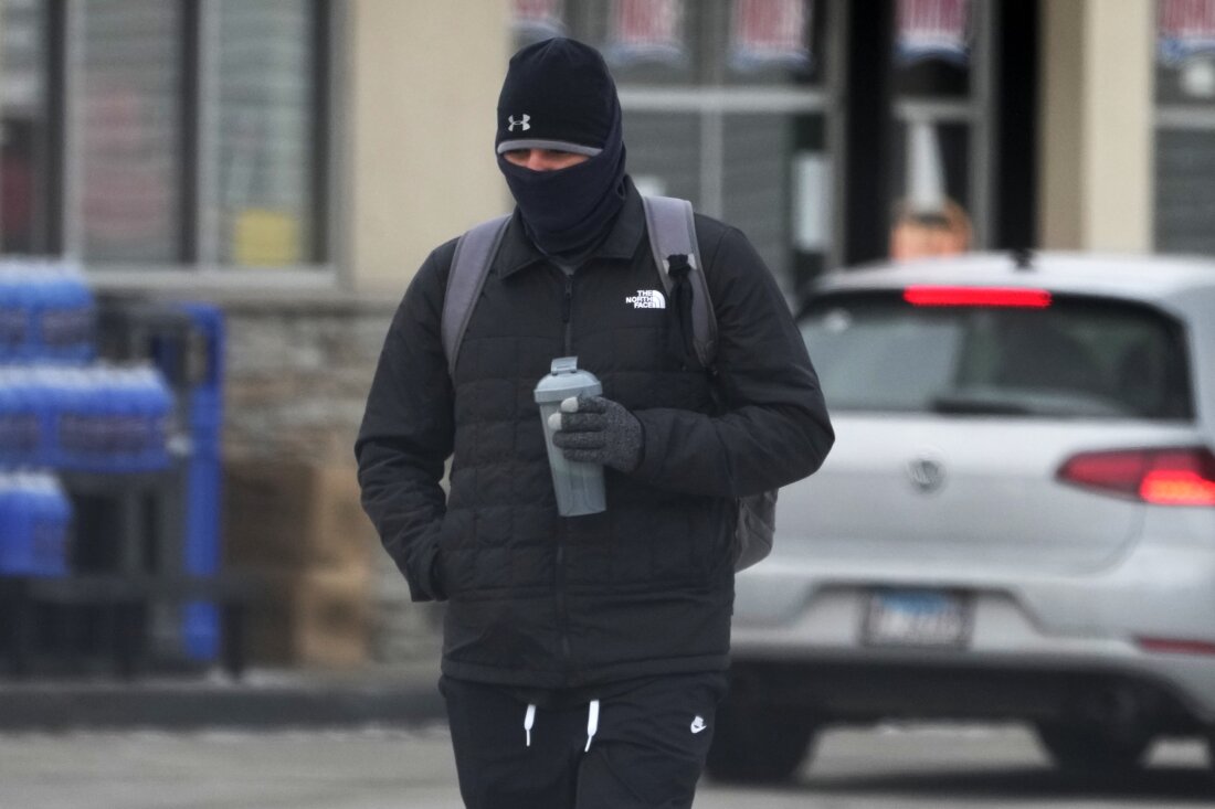 A pedestrian bundles up as he walks on the street during cold weather in Chicago on Jan. 8.