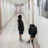 Children wait outside of an immigration court at the Jacob K. Javits Federal Building on July 31, 2026 in New York City.