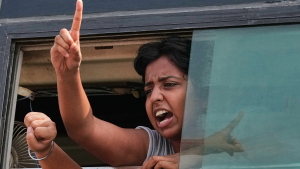 A protester shout slogans as they are detained and taken in a police vehicle during a protest demanding the resignation of Chief Election Commissioner Gyanesh Kumar in New Delhi, India, Saturday, Oct. 10, 2026.