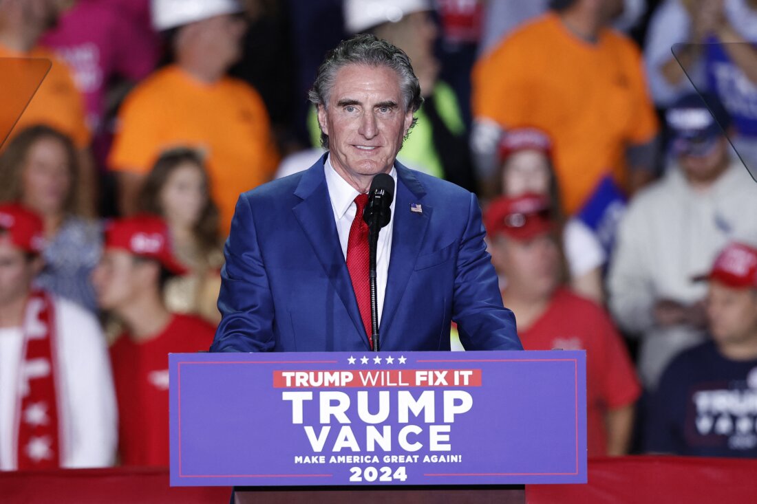 North Dakota Gov. Doug Burgum, pictured at a campaign rally early this month in Michigan, would play a key role in pushing President-leect Donald Trump's agenda to increase oil, gas and coal production on public lands if he is confirmed as secretary of the Interior Department.