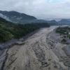 A drone view shows a major section of Pasang Lhamu Highway washed away along the swollen Trishuli River by recent flash floods.