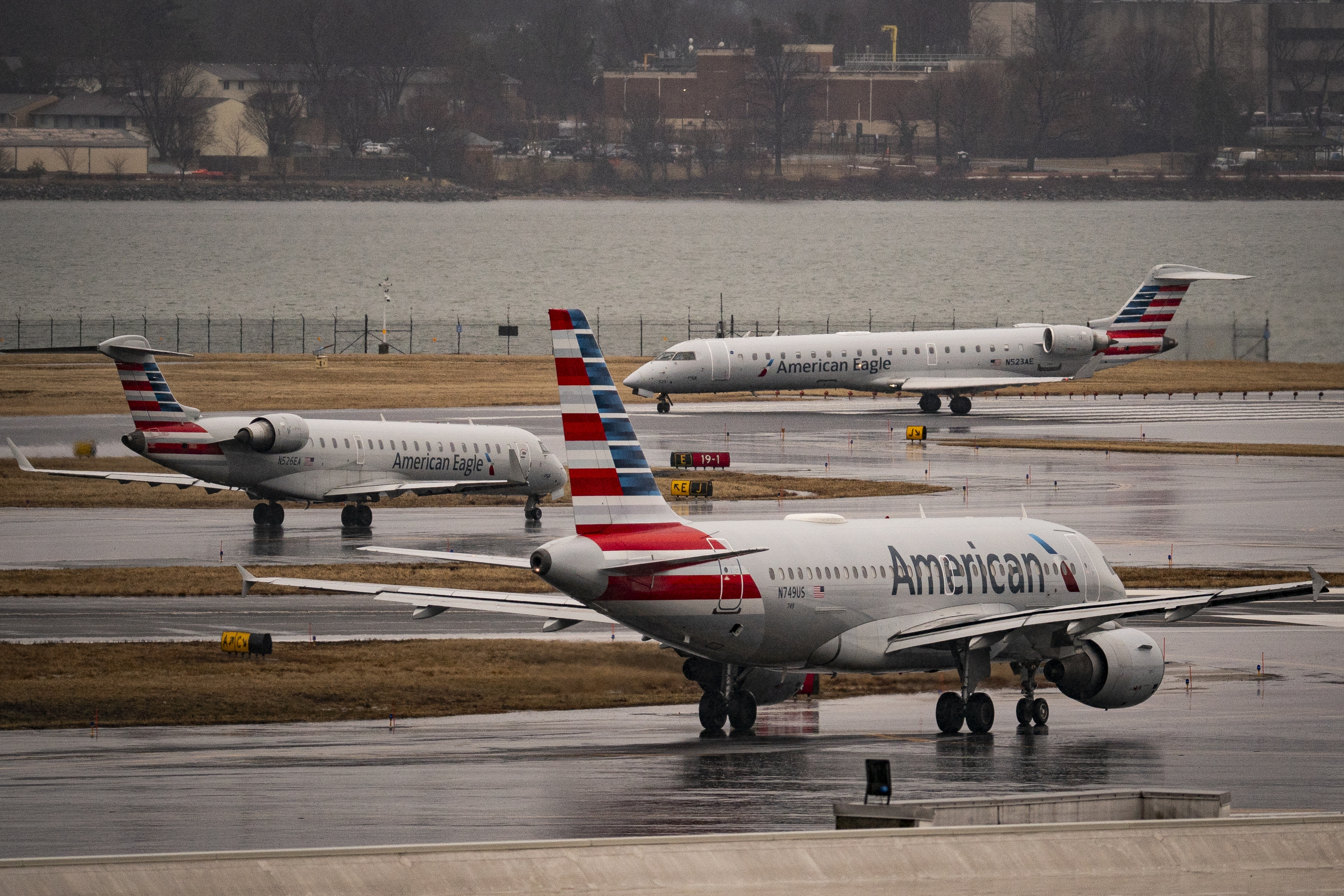 American Eagle and American Airlines planes taxi at the Ronald Reagan Washington National Airport, on February 6, 2025 in Arlington, Va. The Federal Aviation Administration has reopened two of the airport