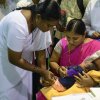 An Indian nurse (L) administers pentavalent vaccine to a child during the launch of the immunisation programme in Hyderabad on June 3, 2015. The single shot of pentavalent vaccine will provide protection to infants from five life-threatening ailments, including diphtheria, pertussis, tetanus (DPT), hepatitis B and pneumonia due to Hib (Haemophilus influenza type b). Launched under the universal immunisation programme of the Government of India in the southern state of Telangana, the pentavalent vaccine will benefit close to 6.31 lakh people annually, according to health authorities.