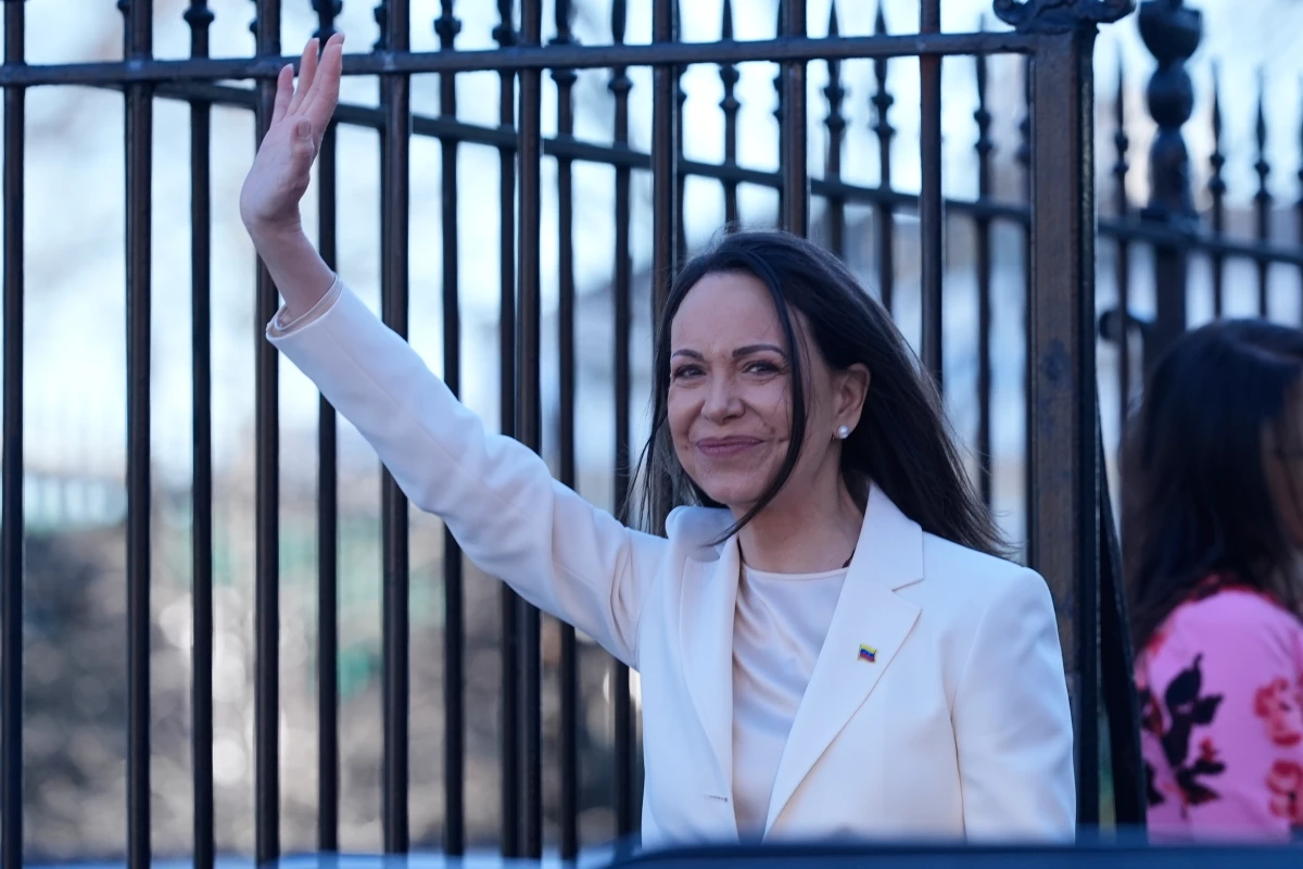 Venezuelan opposition leader María Corina Machado waves to supporters on Pennsylvania Avenue as she leaves the White House after meeting with President Donald Trump Thursday, Jan. 15, 2026, in Washington.