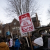 People demonstrate against federal immigration enforcement outside the Minnesota governor's residence in St. Paul on Feb. 6.