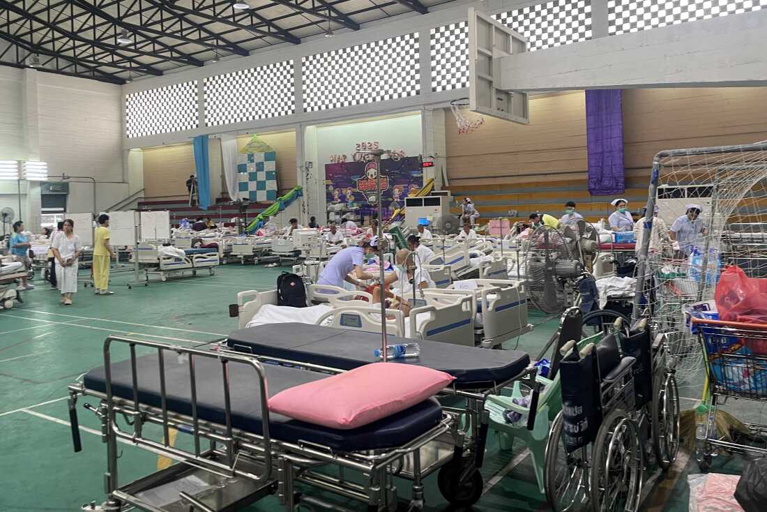Patients are attended to in a makeshift medical treatment area
