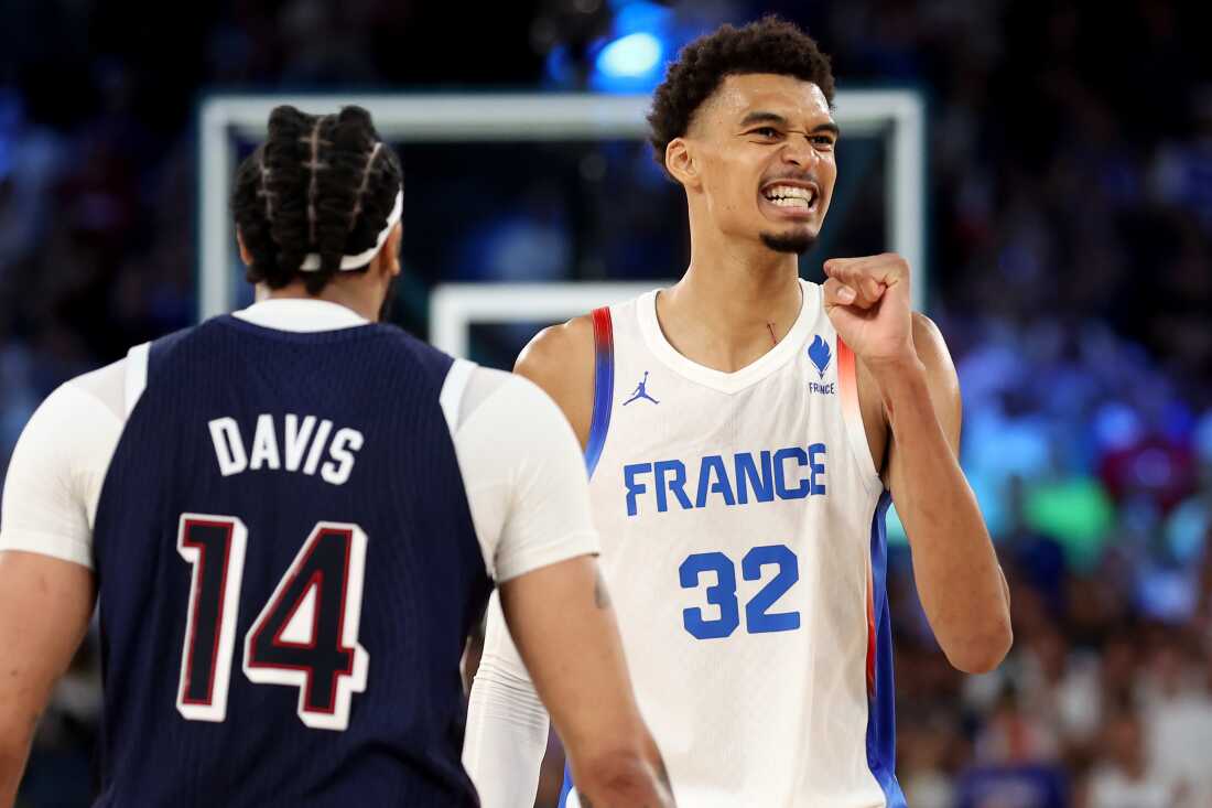 Victor Wembanyama (r) reacts during the men's gold medal game between France and the United States. He scored 26 on the night in his team's 98-87 loss.