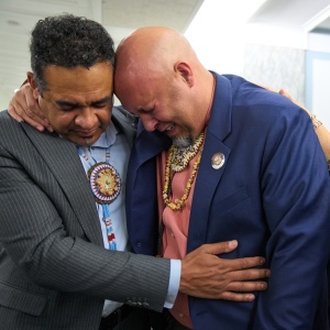 John Lowery, a New Carolina state representative and chairman of the Lumbee Tribe (right) is comforted by Rob Jacobs, as they join with other members of the tribe to celebrate Wednesday on Capitol Hill in Washington, D.C., after the passage of a bill granting the tribe federal recognition.