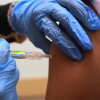 Pharmacy manager Aylen Amestoy administers a patient with a seasonal flu vaccine at a CVS Pharmacy in Miami, Tuesday, Sept. 9, 2025.