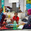 Balraam Singh, 35, eats breakfast with his wife, Nusaa Davii, and their 7-year-old son, Munna, on the pavement outside Safdarjung Hospital in New Delhi, India. The child is receiving treatment for a heart condition, and the family has been sleeping on the pavement outside the hospital for the past 20 days.