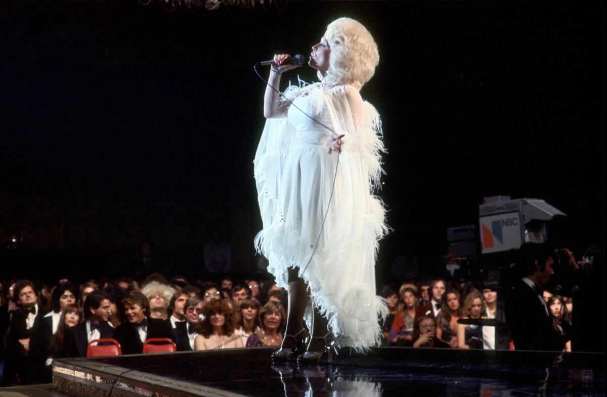 Dolly Parton didn't just write hits — she created an American songbook 1 Country singer Dolly Parton performs onstage, circa 1977.