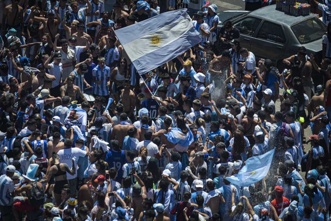 Fans of Argentina celebrate the country's 2022 World Cup win in Buenos Aires in December 2022.