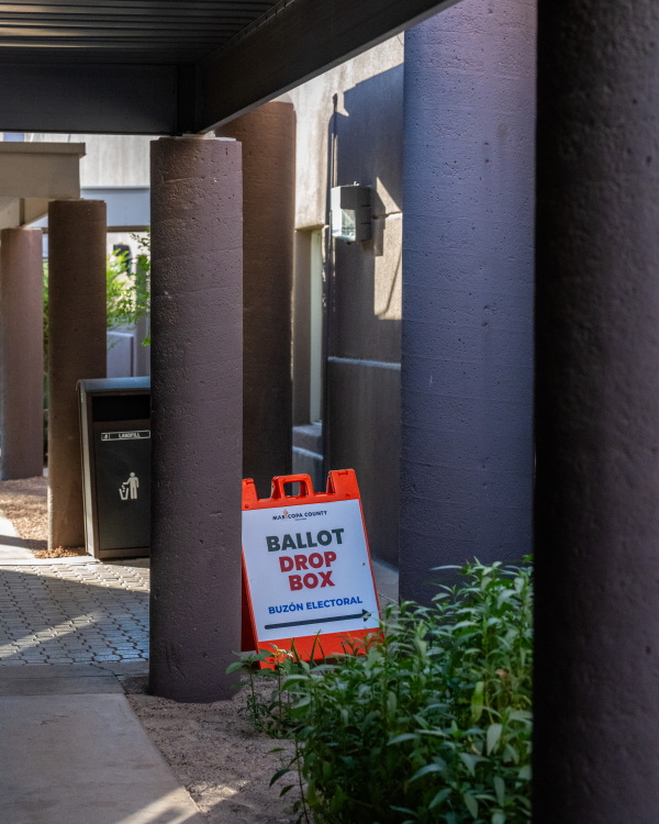 A sign reading "Ballot Drop Box" is seen in Phoenix, Ariz., on Oct. 9, 2024.