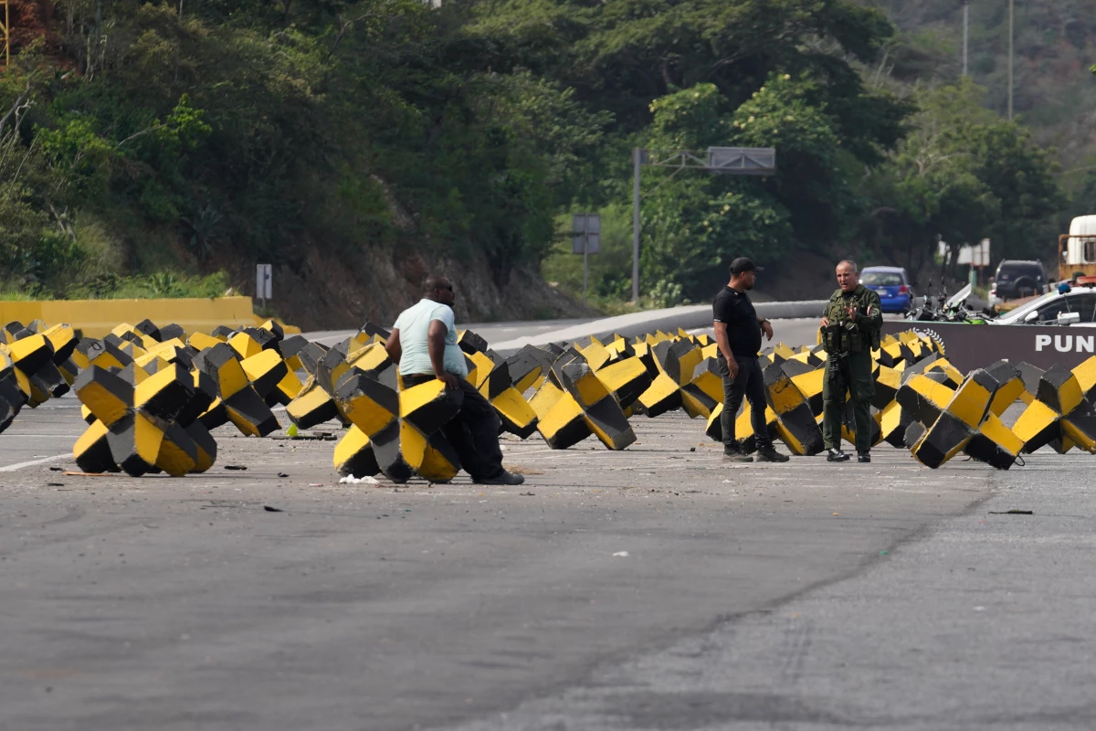 Concrete blocks block the highway leading from Simón Bolívar International Airport to Caracas in Maiquetía, Venezuela.