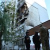 Rescuers work at the damaged apartment building following a Russian air attack in Lviv, Ukraine, Thursday, July 30, 2026.