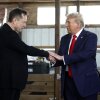 President-elect Trump shakes hands with Elon Musk at a campaign stop in Butler, Pa., on October 5, 2024. Trump has named Musk and former presidential hopeful Vivek Ramaswamy co-leaders of a new commission called the "Department of Government Efficiency," which will advise and guide Trump in his quest to "dismantle government bureaucracy."
