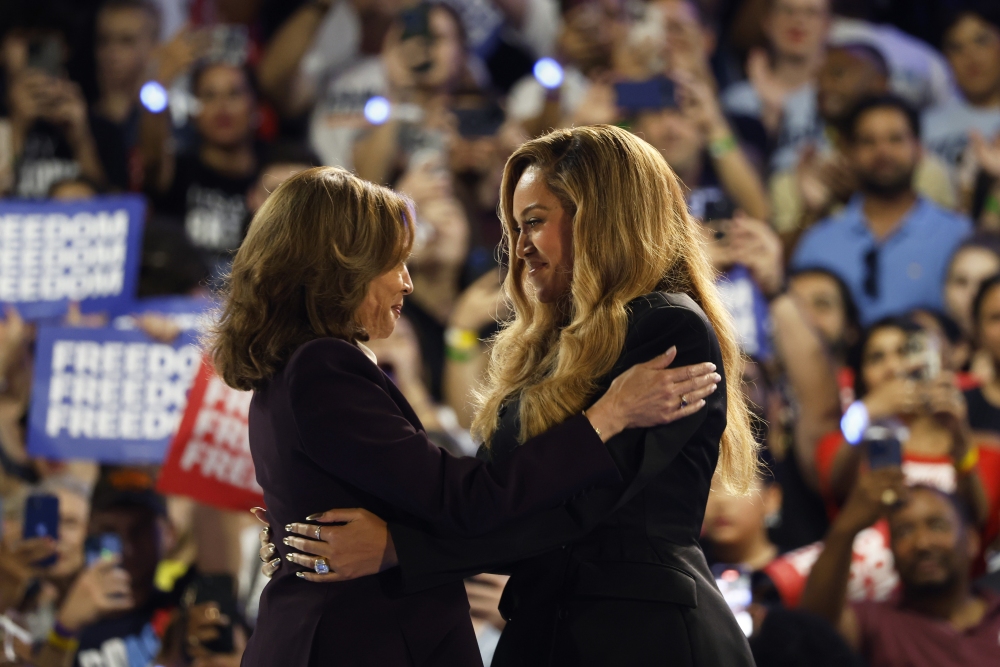 Beyonce, right, and Vice President Kamala Harris embrace on stage during a campaign rally Friday in Houston. (AP)