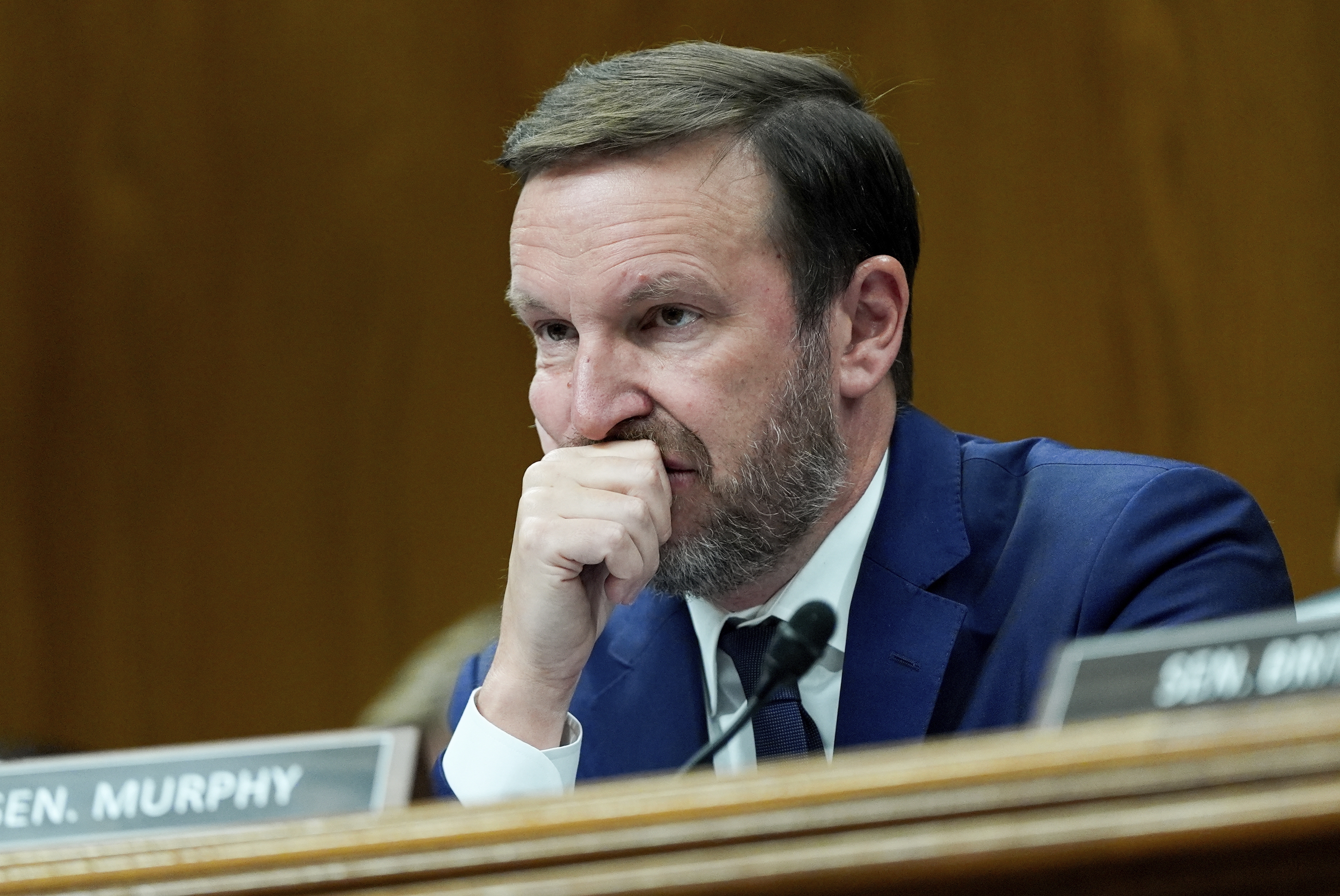 Sen. Chris Murphy, D-Conn., listens as Homeland Security Secretary Kristi Noem speaks during a Senate Appropriations Subcommittee on Homeland Security oversight hearing, Thursday, May 8, 2025, on Capitol Hill in Washington.