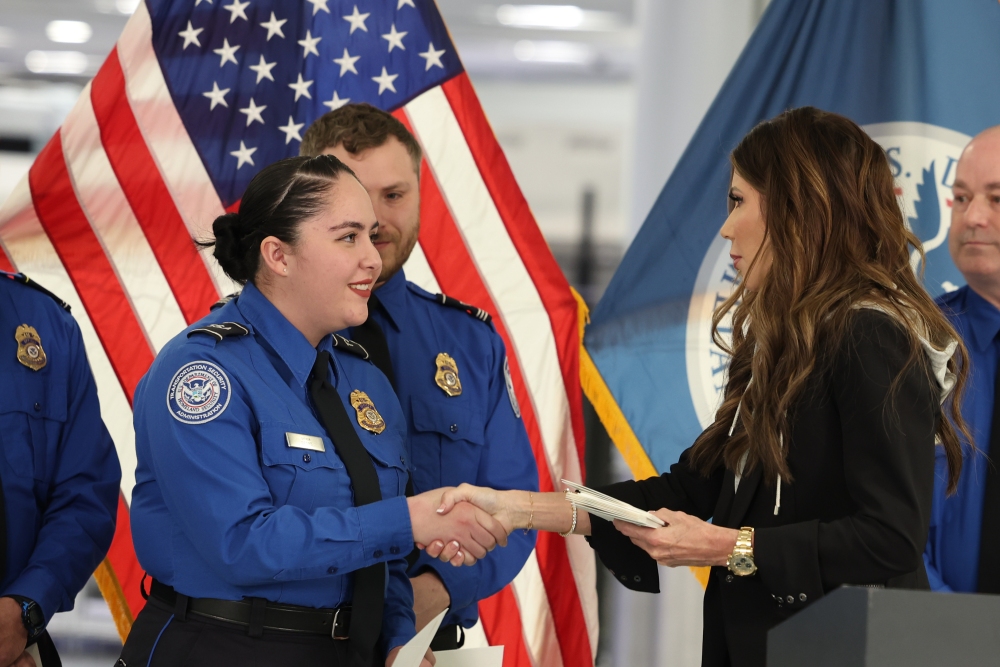 FILE - U.S. Homeland Security Secretary Kristi Noem, right, shakes hands with Transportation Security Administration Officer Monica Degro at a news conference at Harry Reid International Airport, Nov. 22, 2025, in Las Vegas. (AP)