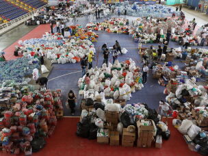 Volunteers sort aid for people affected by the earthquake in Cali, Colombia, Wednesday, Aug. 12, 2026.