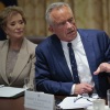Health Secretary Robert F. Kennedy Jr. and Education Secretary Linda McMahon are pictured. Kennedy is speaking; McMahon is on the left.