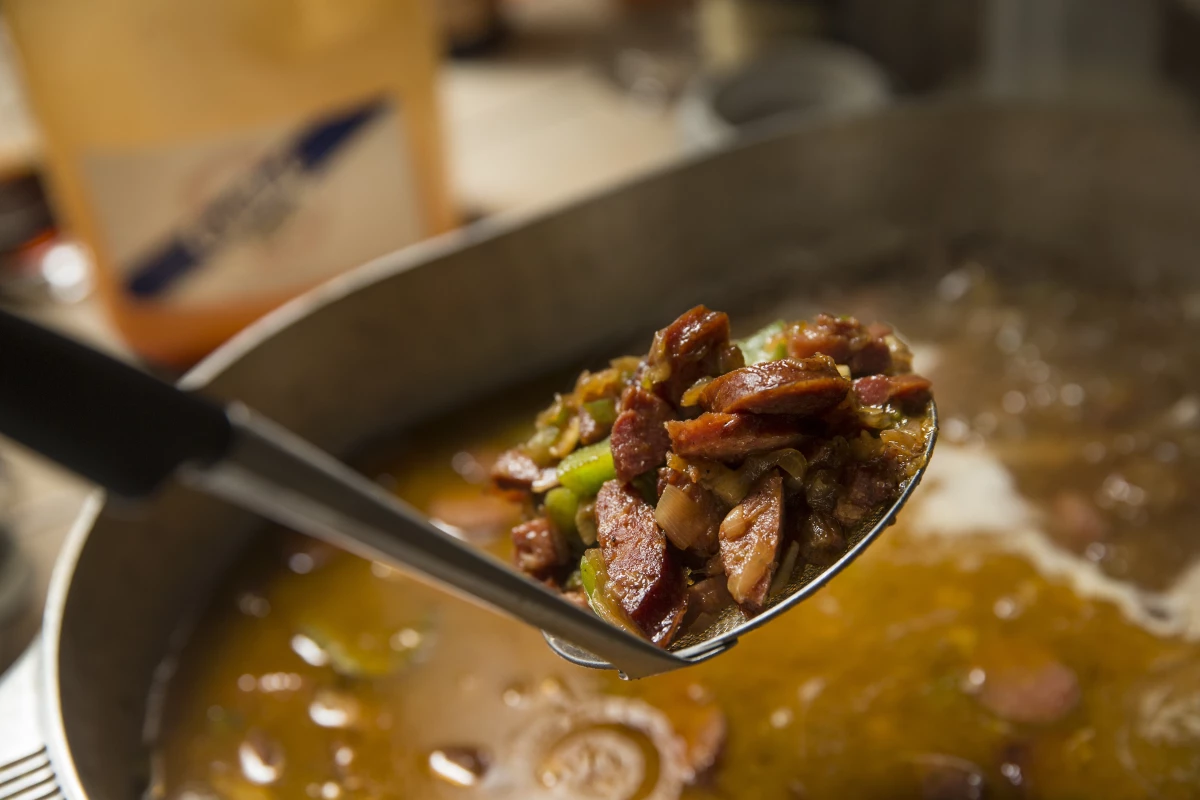 Andouille or other sausage adds a kick to the thick turkey bone gumbo broth.