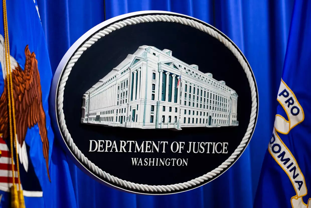 The U.S. Department of Justice logo is before a news conference, Monday, May 4, 2026, in Washington.
