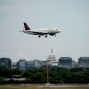 The U.S. Capitol is visible in the distance as a Delta Air Lines flight approaches Ronald Reagan Washington National Airport in 2022.